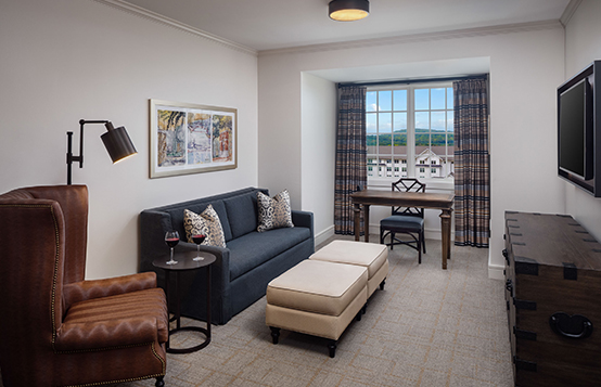 a living room with a couch and a table