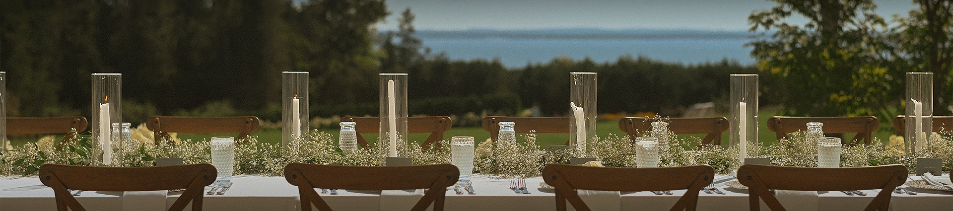 a table set up with flowers and candles