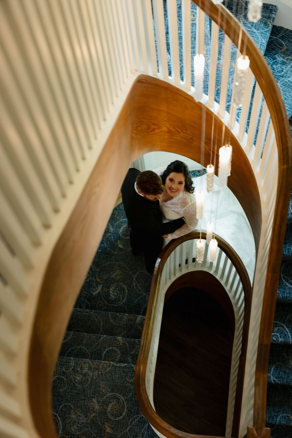 Lovely bride and groom moment on the historic staircase of Stonecliffe