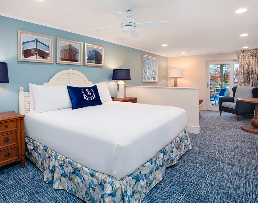 a room with a bed and a ceiling fan