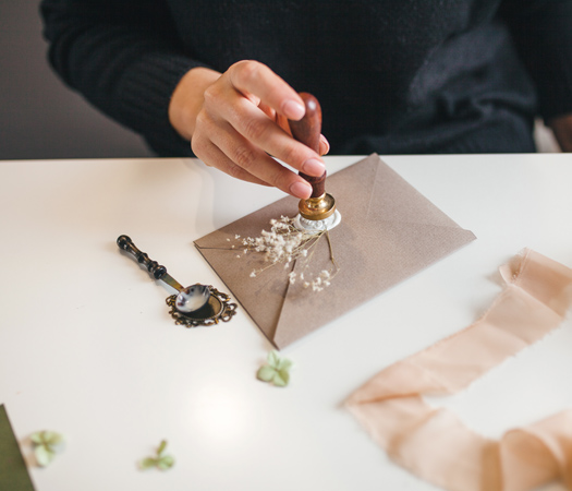 a person stamping a envelope