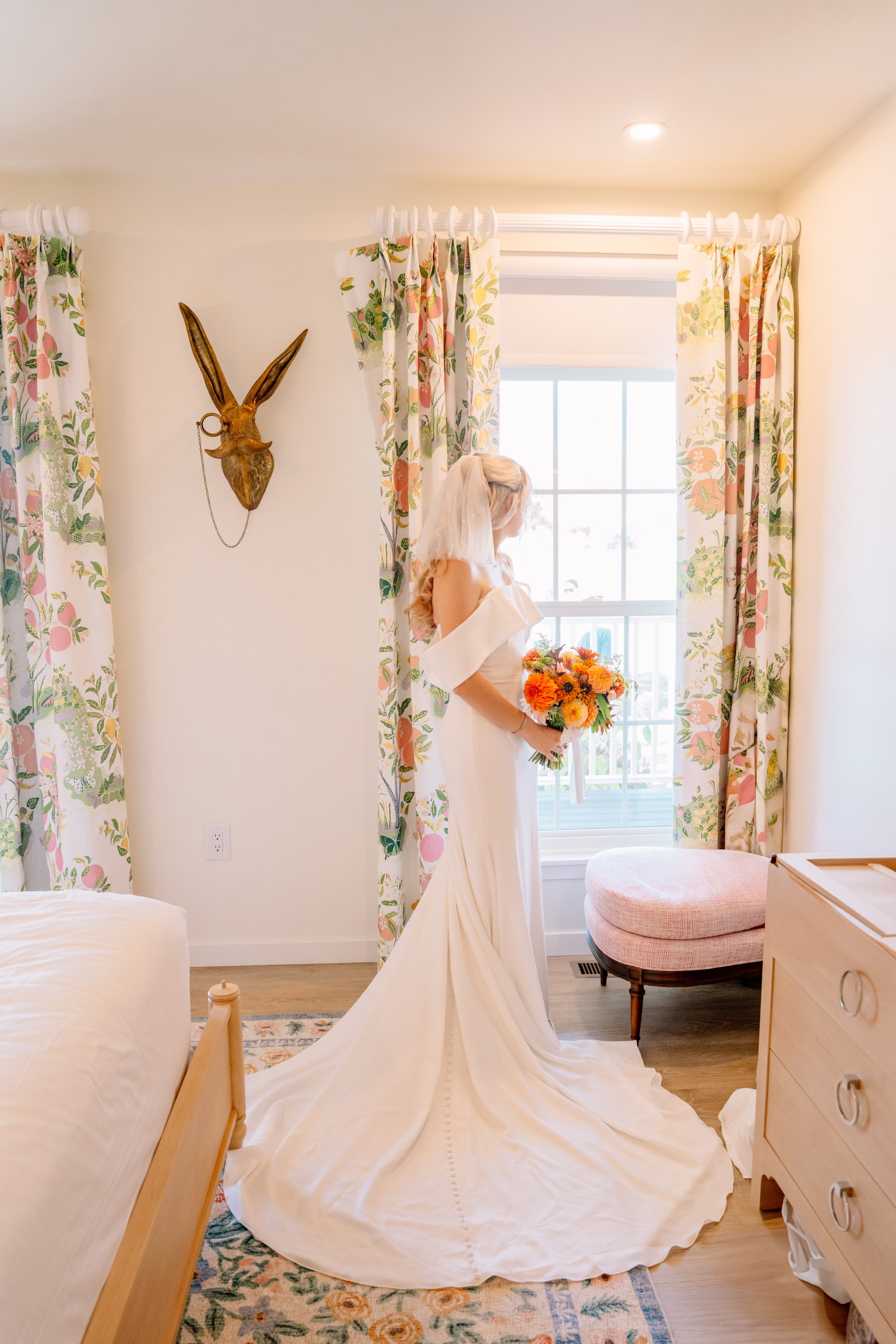 a woman in a wedding dress holding a bouquet