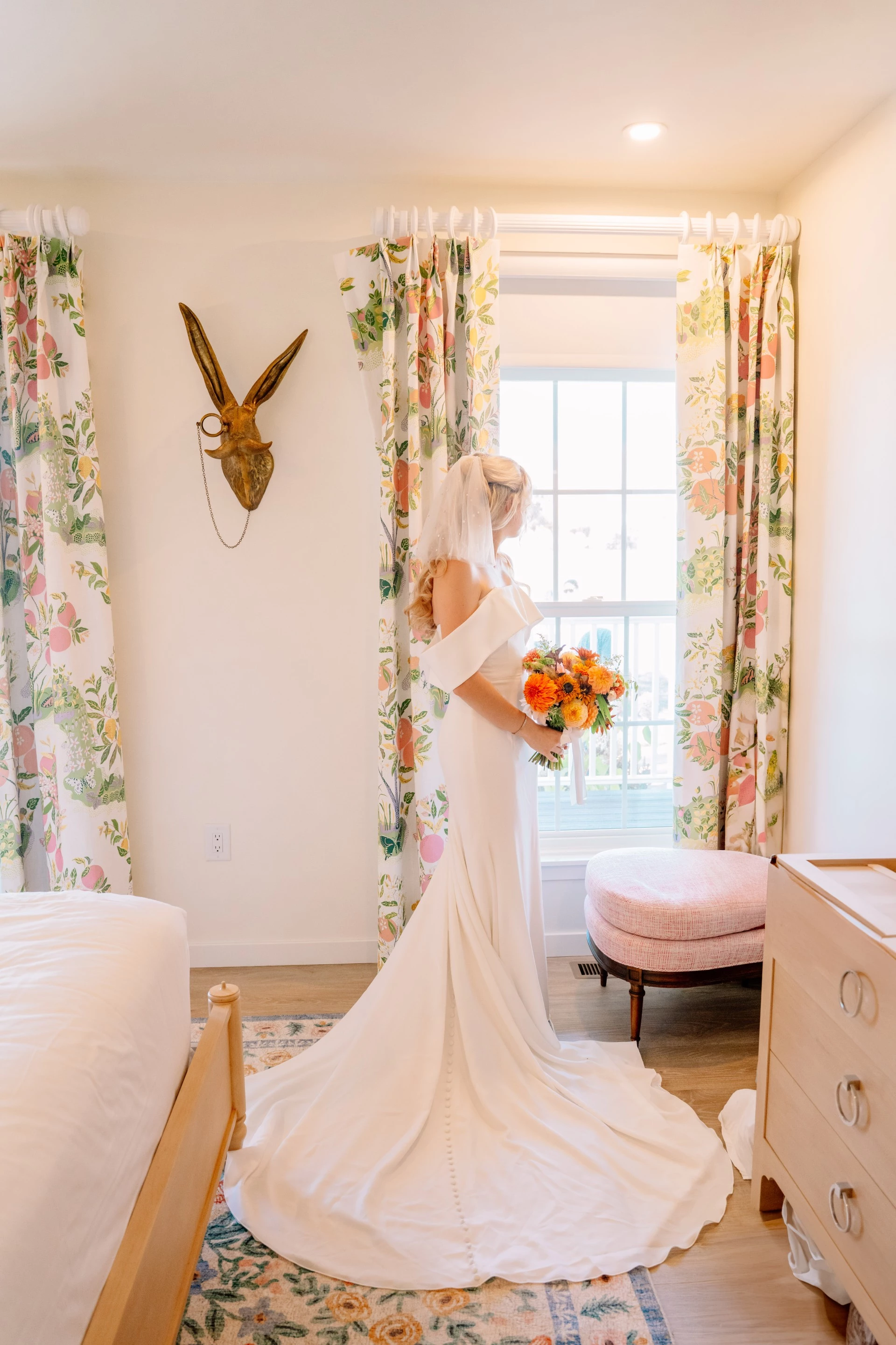 a woman in a wedding dress holding a bouquet