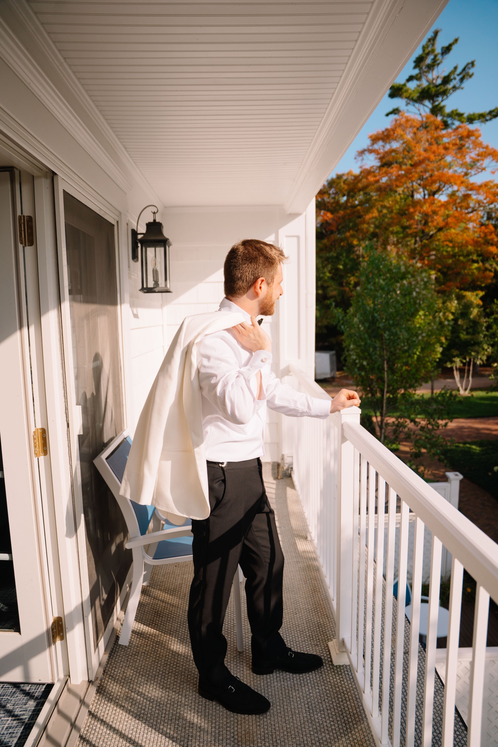 a man standing on a porch