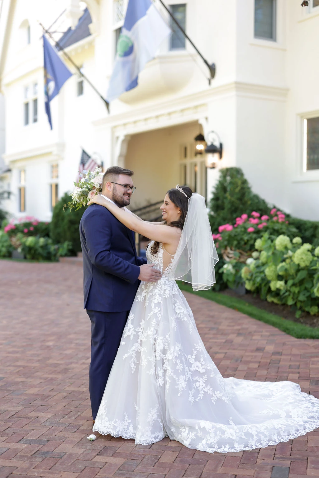 Bride and Groom looking at each other outside of Stonecliffe Mansion