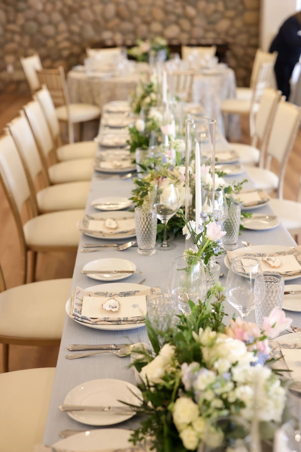 a long table with plates and glasses