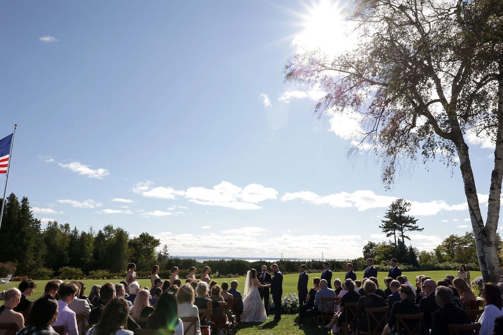a wedding ceremony in a grassy area