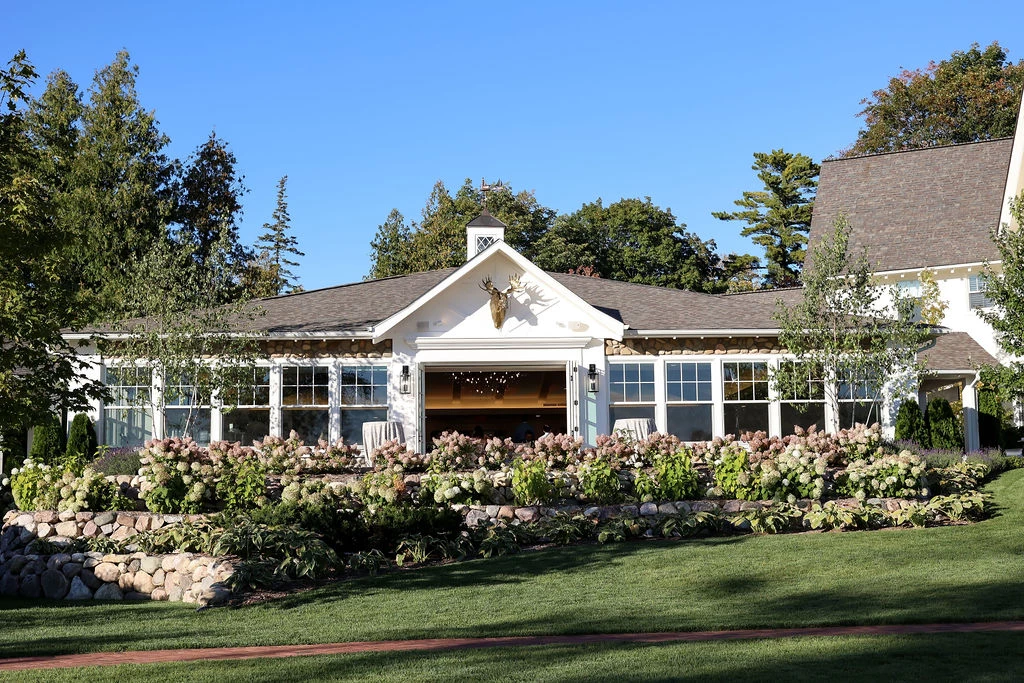 a house with a garden and trees