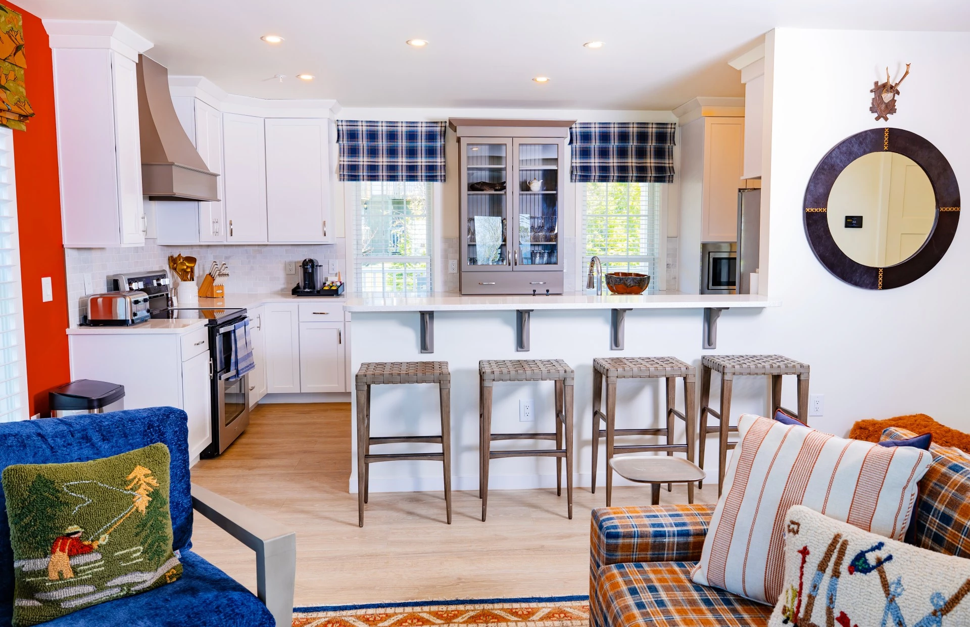 a kitchen with a couch and stools