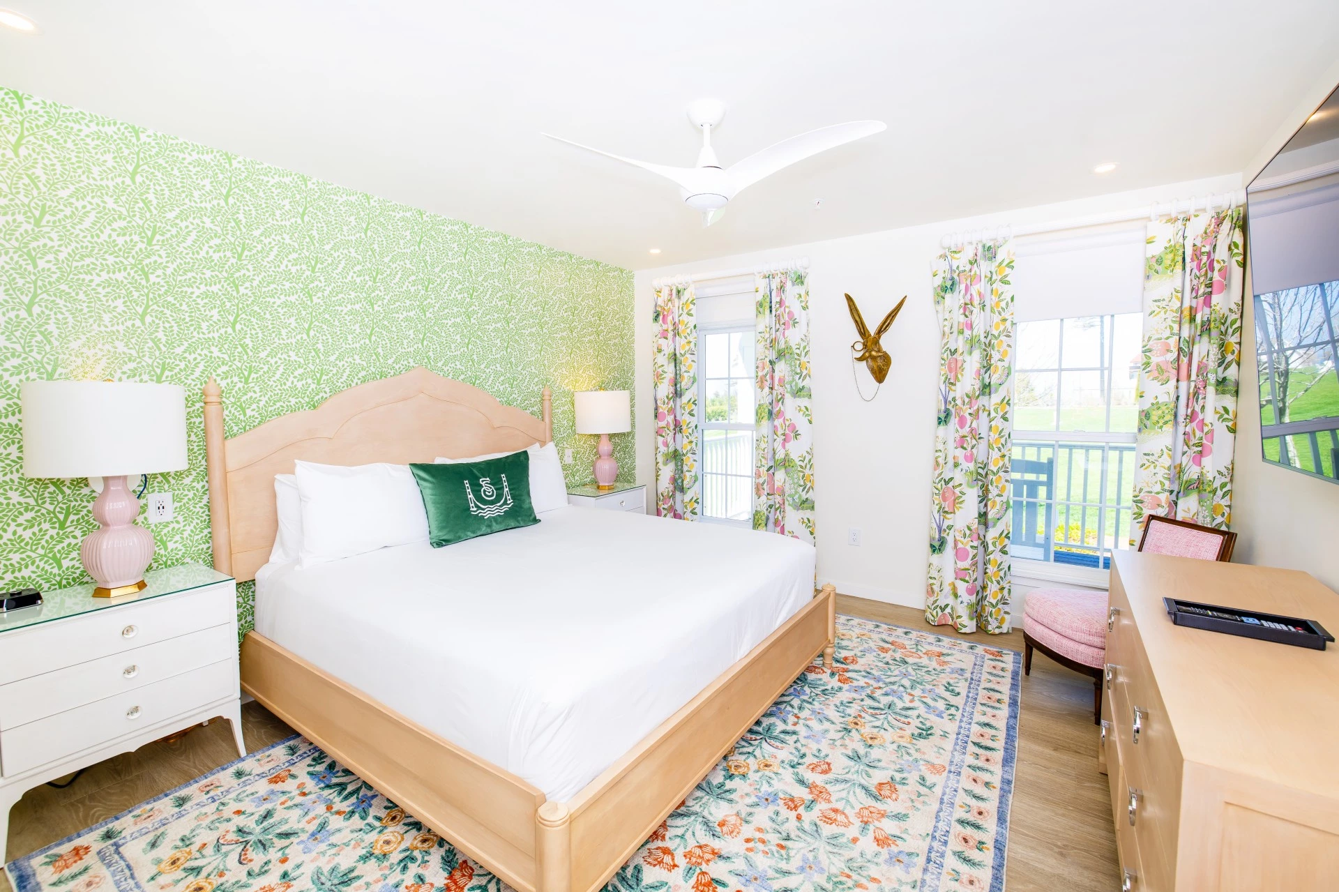 a bedroom with a bed and a rug