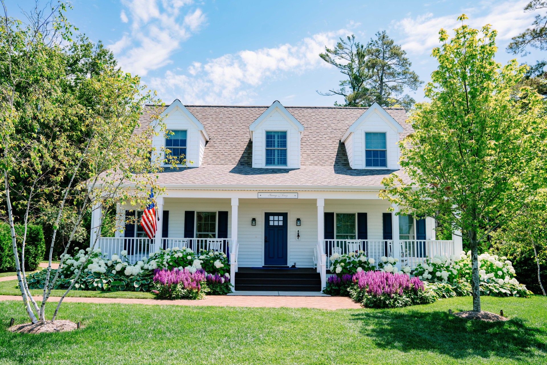 a house with a lawn and trees