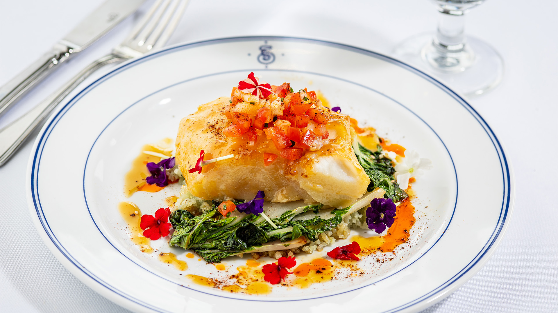 a plate of food with flowers on top