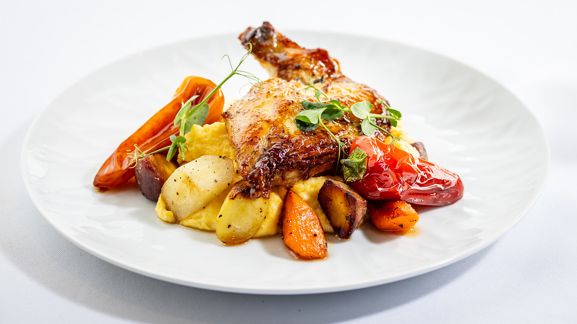 a plate of food on a white surface