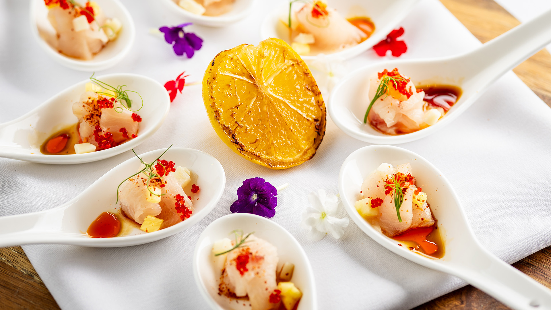 a group of small white bowls with food in them