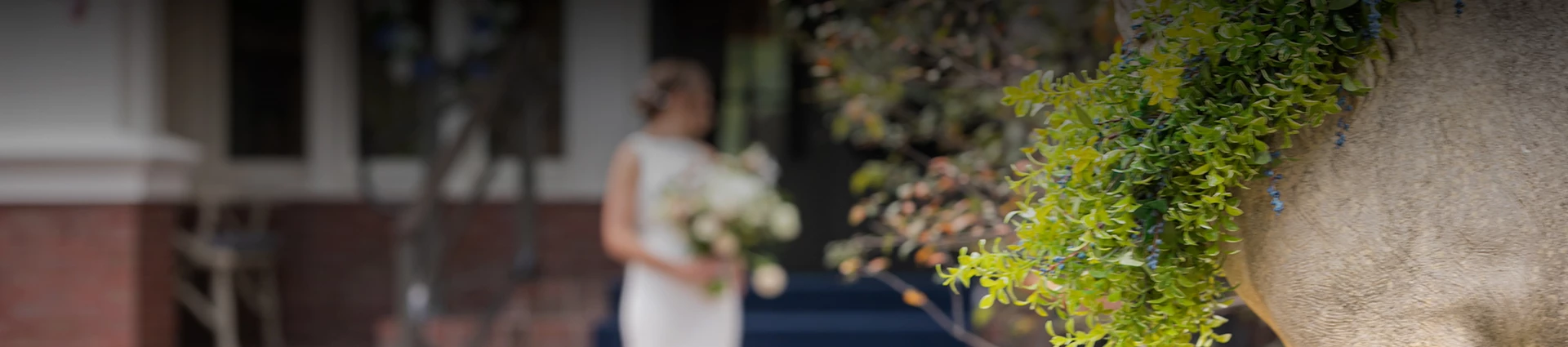 a blurry image of a woman holding flowers