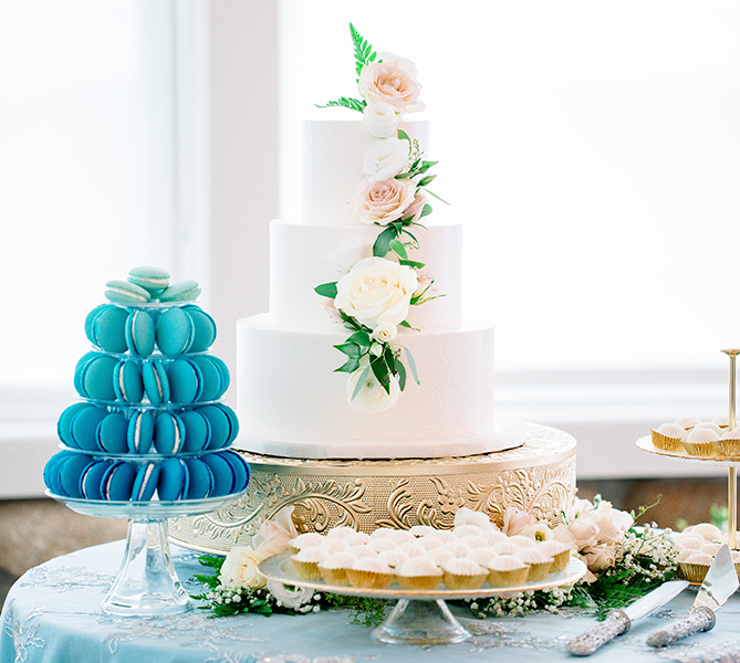 a cake and cupcakes on a table