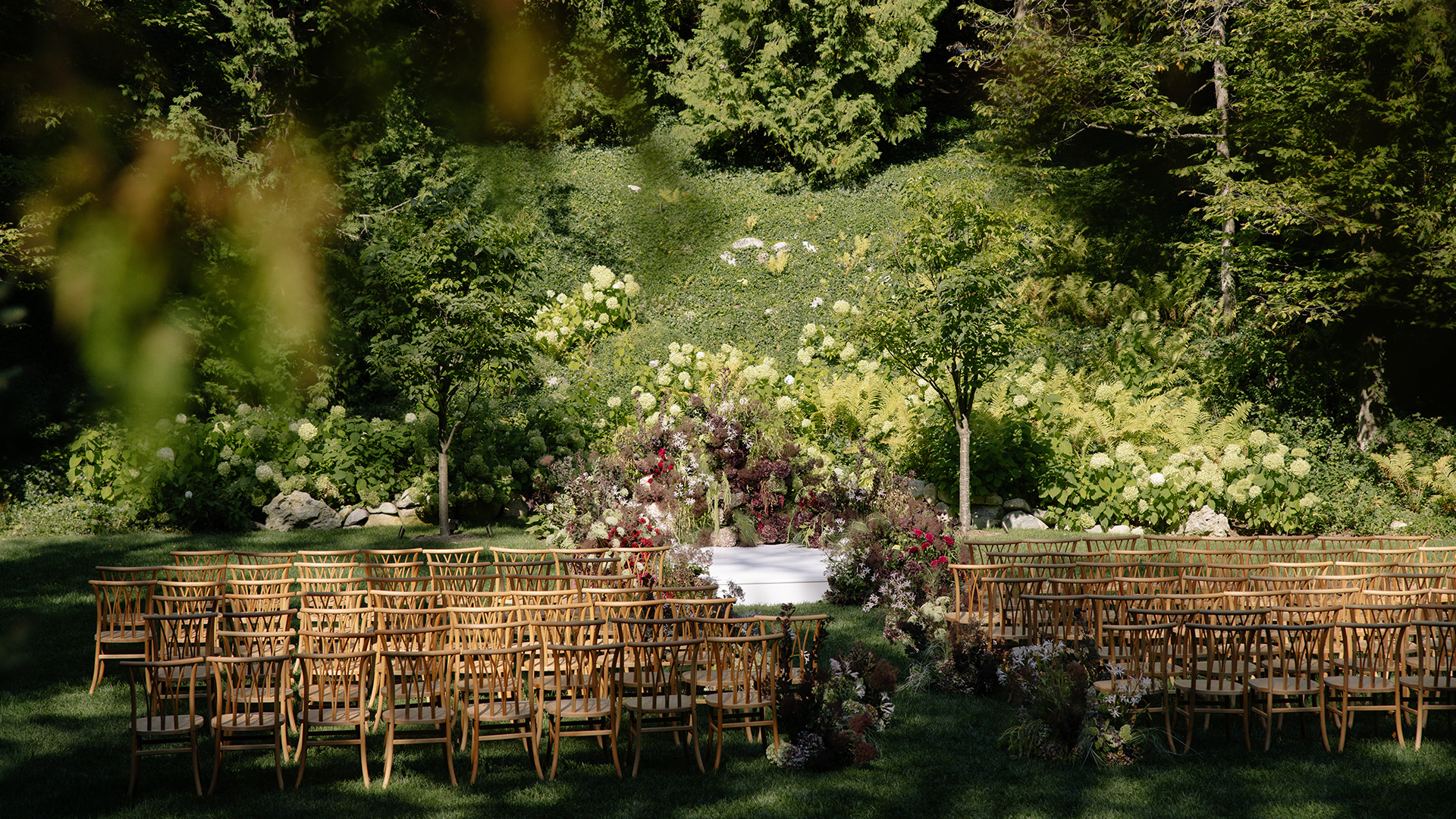 a group of chairs in a garden