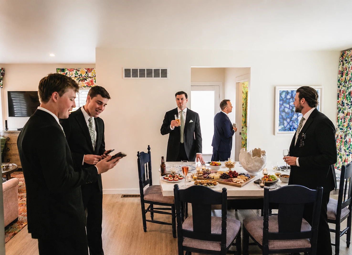 a group of men in suits standing around a table