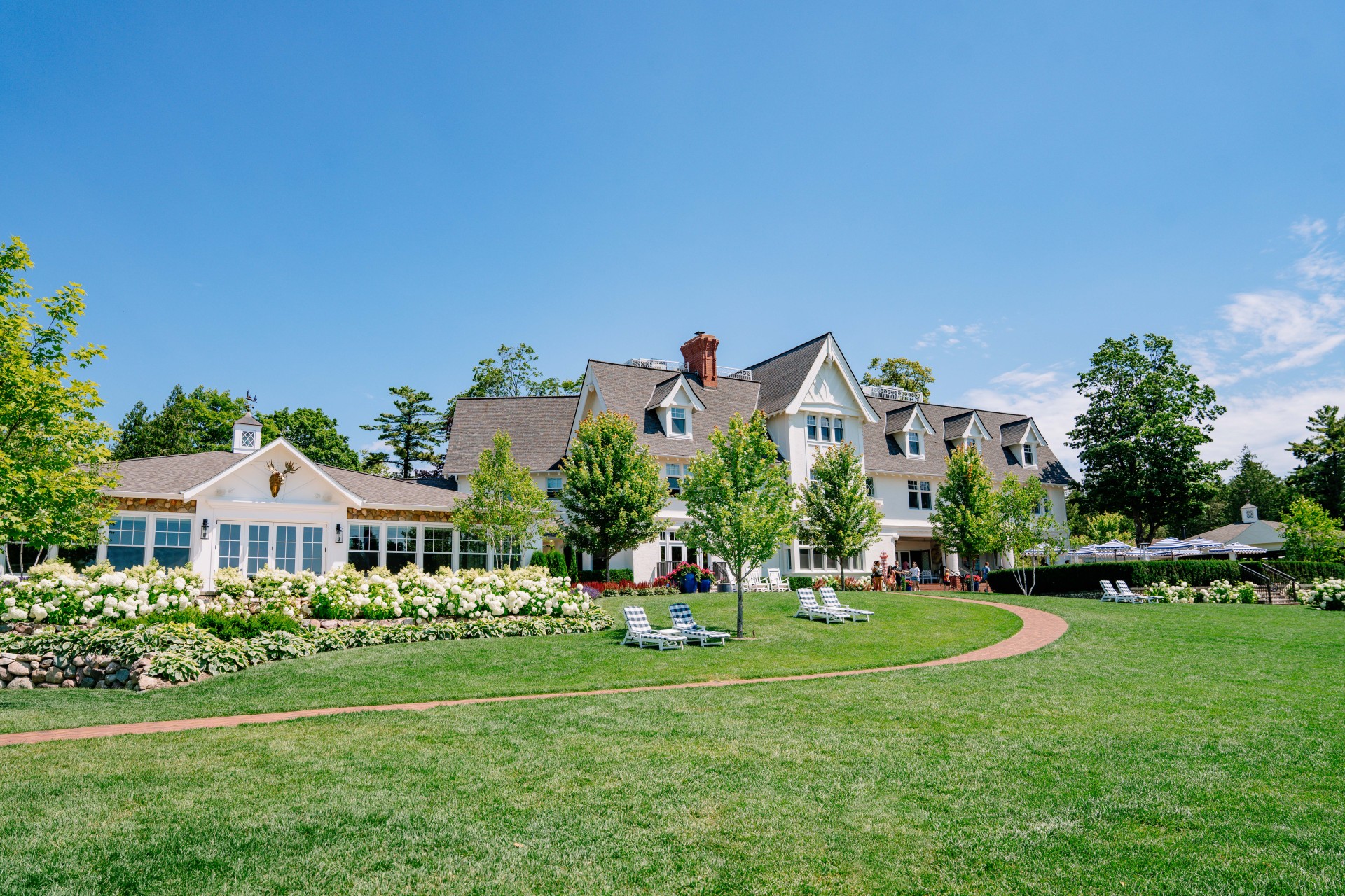 View of historic mansion and event center on beautiful sunny day