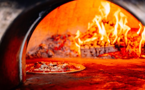 a pizza in a wood oven