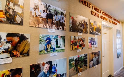 a wall with pictures of people on it
