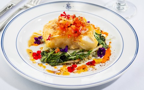a plate of food with flowers on top