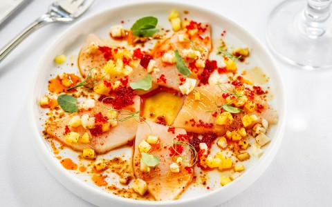 a plate of food with a spoon and fork