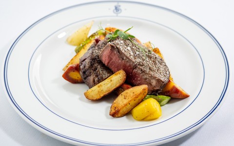 a plate of food on a white surface