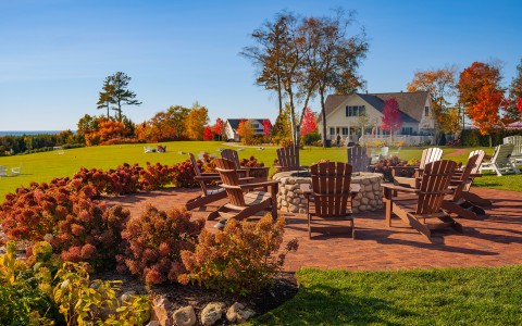 a fire pit with chairs around it