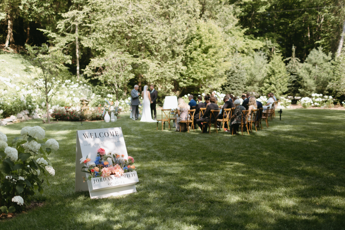 Luxury destination wedding ceremony at The Inn at Stonecliffe on Mackinac Island, a private and scenic Upper Michigan wedding venue overlooking the Straits of Mackinac.