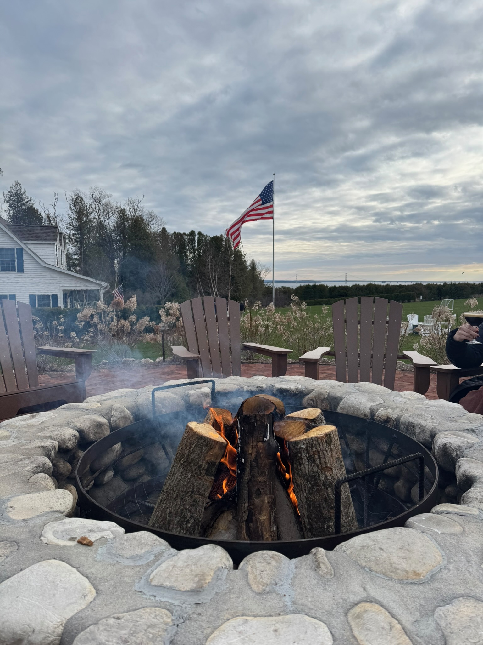 a fire pit with a flag in the background