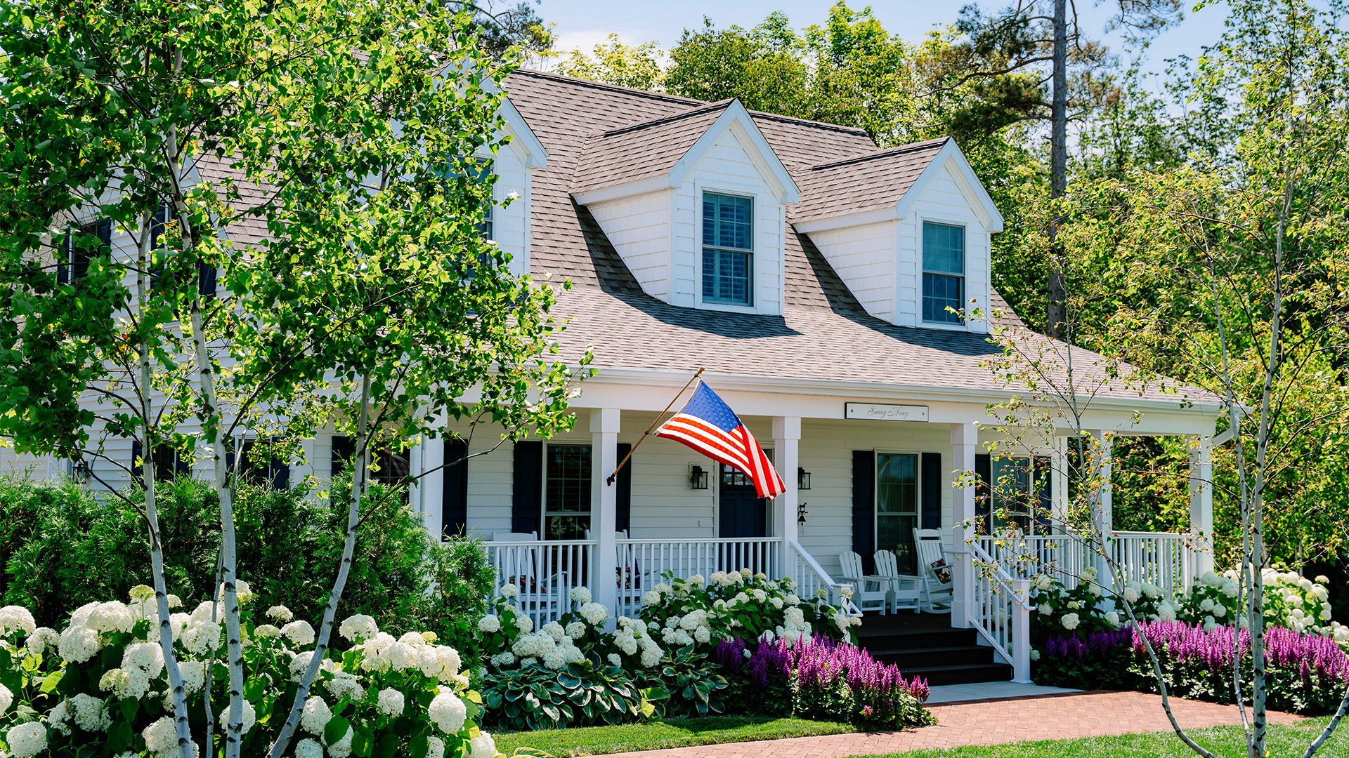 a house with a flag on the front porch