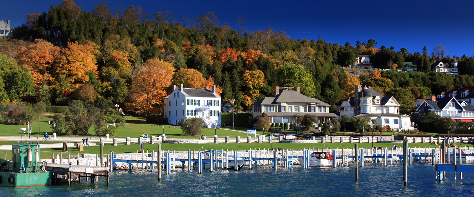 The Inn at Stonecliffe on Mackinac Island with hillside and waterfront backdrop.
