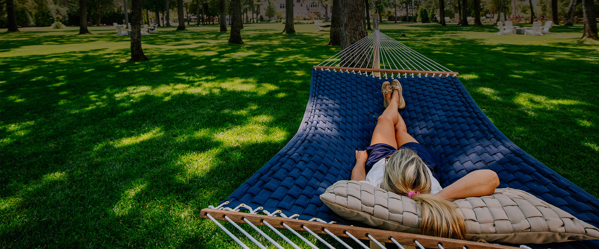 a woman lying on a hammock