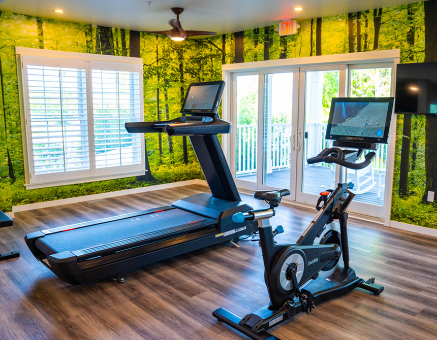 a exercise bike and treadmill in a room
