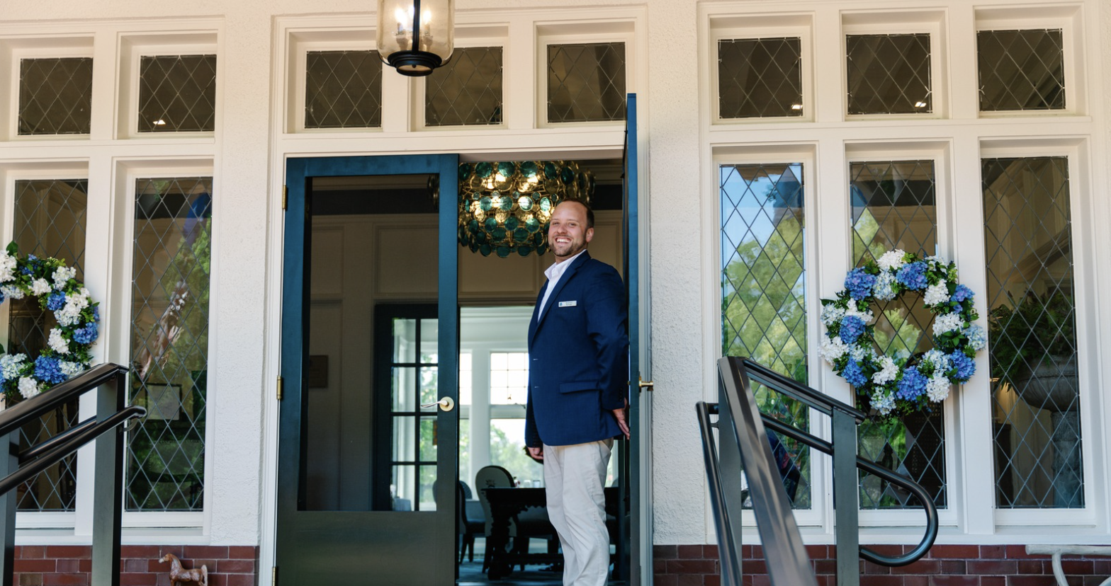 a man standing in front of a door