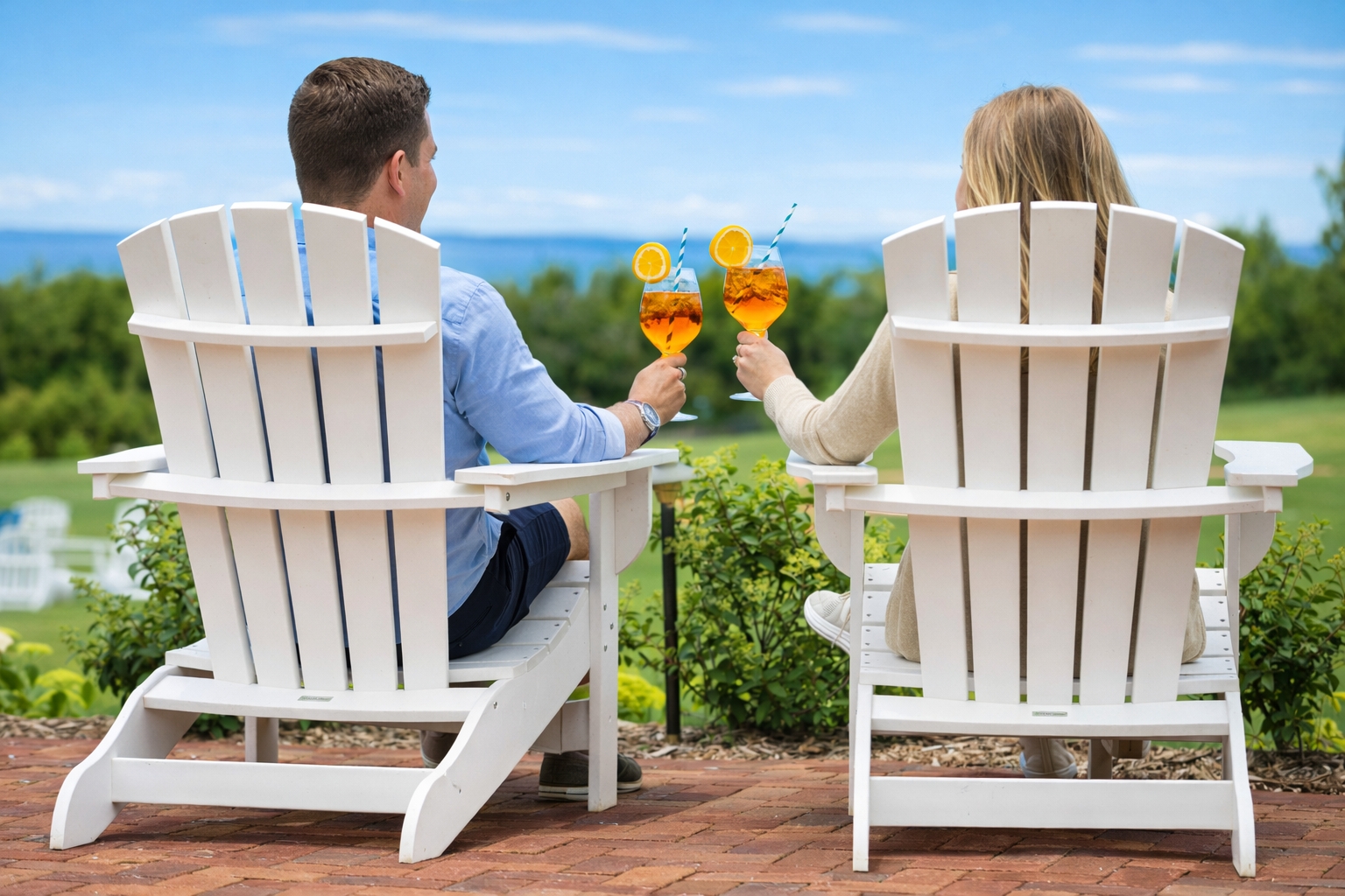 Guests relaxing on the lawn at The Inn at Stonecliffe enjoying a peaceful luxury Great Lakes summer retreat experience