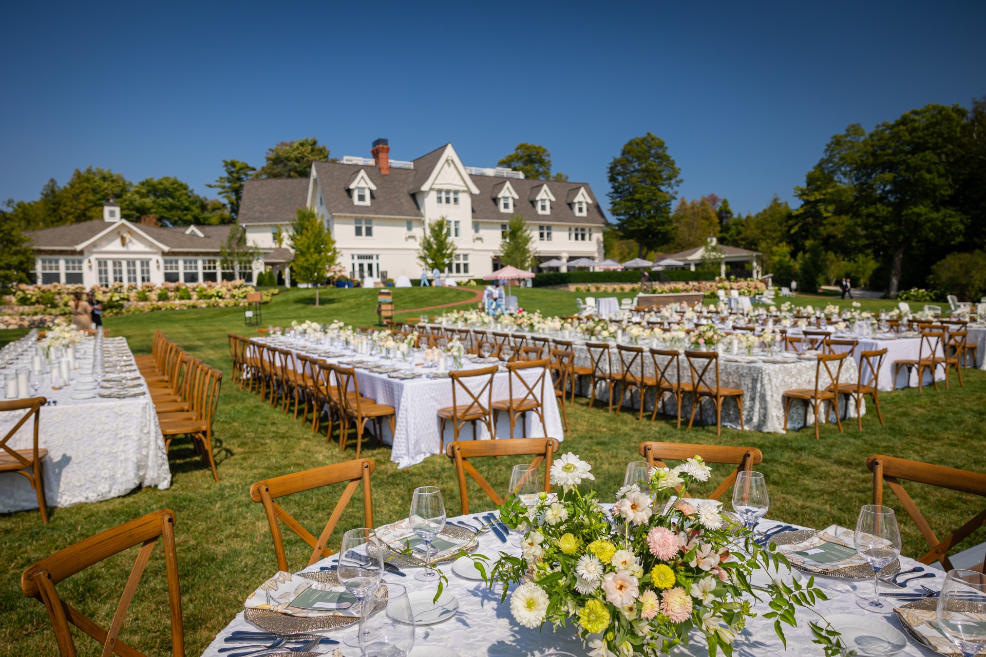 Outdoor wedding ceremony at The Inn at Stonecliffe on Mackinac Island overlooking the Straits of Mackinac and Mackinac Bridge, Northern Michigan luxury wedding venue