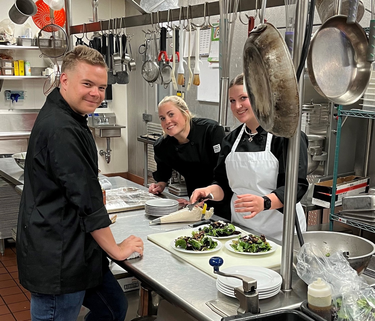 a group of people in a kitchen