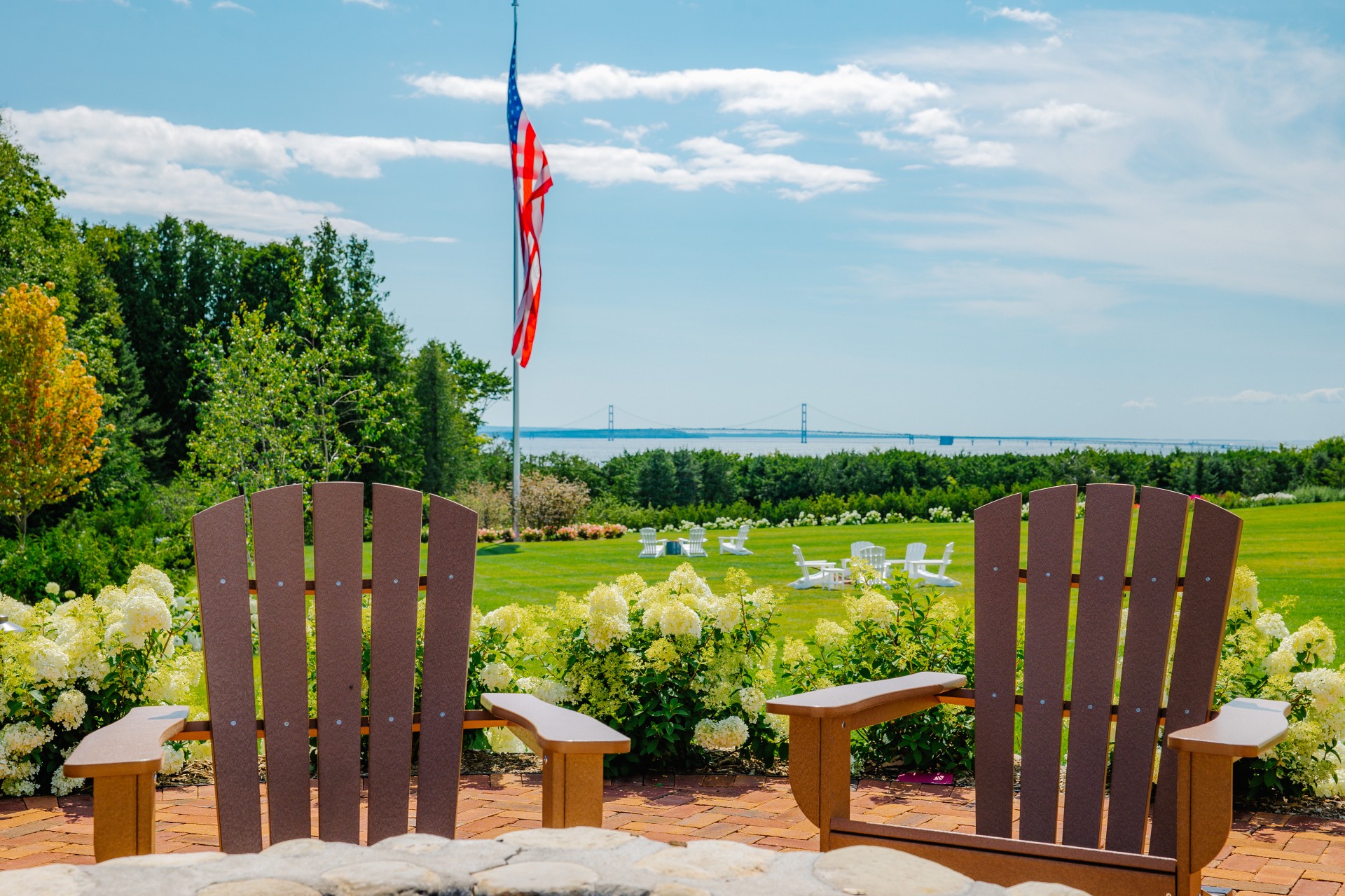 a lawn chairs with a flag in the background