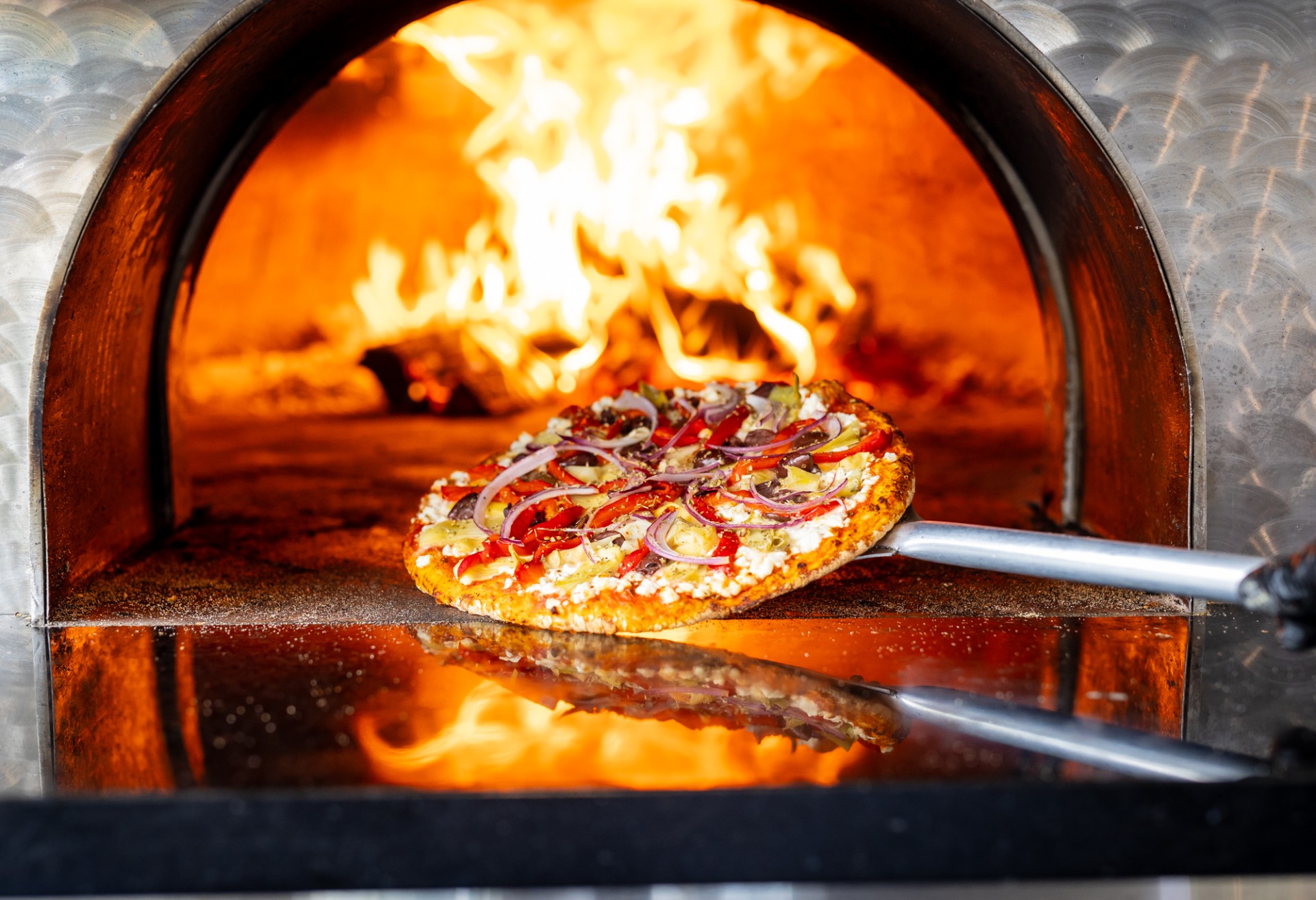 a pizza in a wood oven at The Backyard at The Inn at Stonecliffe