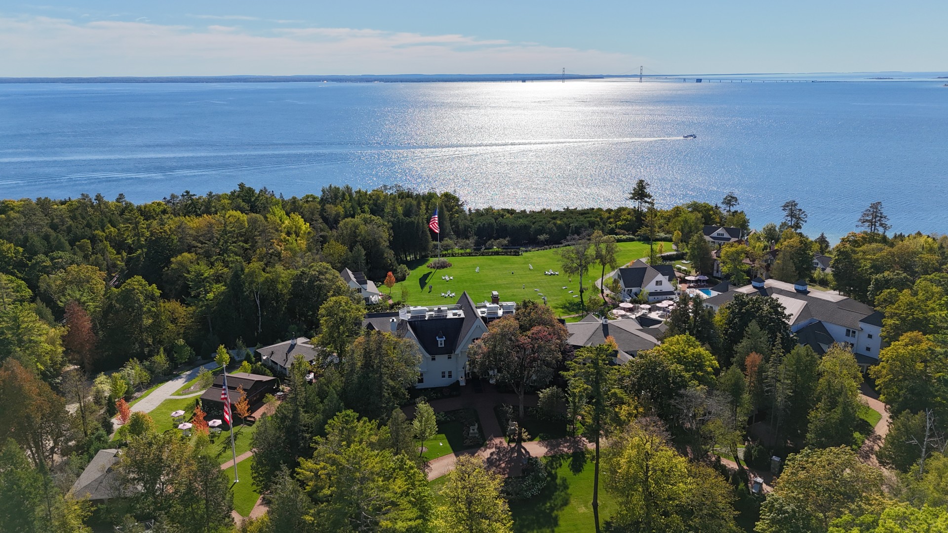 a large body of water with houses and trees