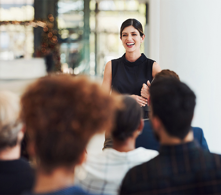 a person standing in front of a group of people