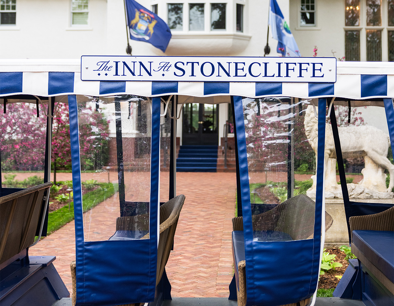 a blue and white striped canopy with blue and white text on it