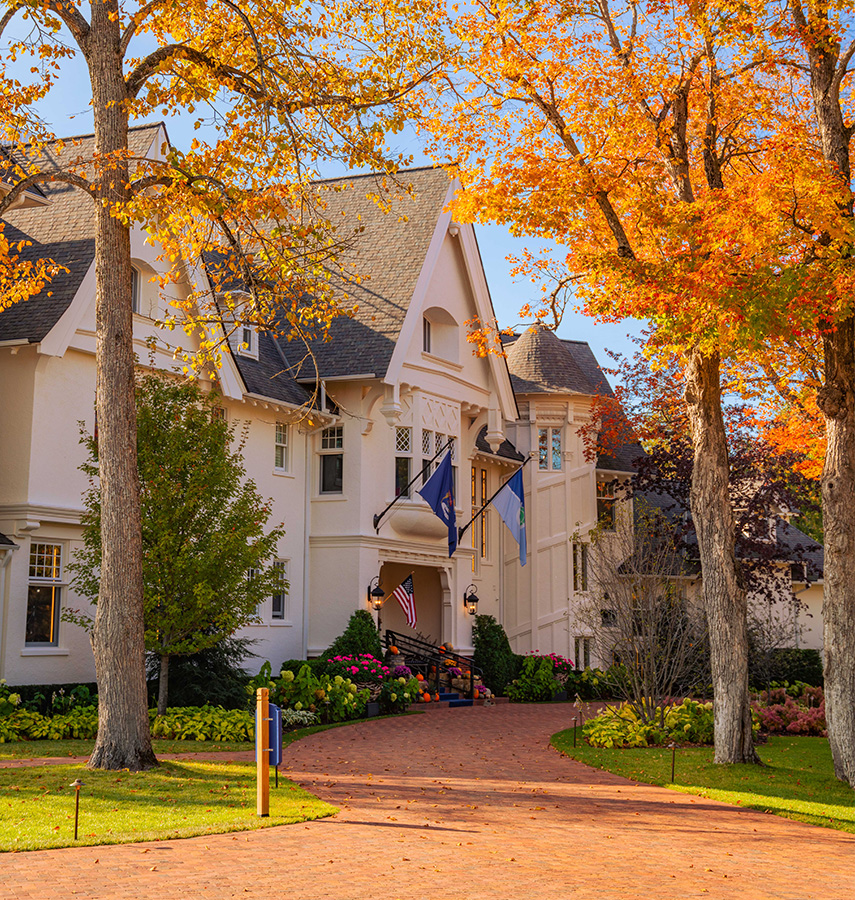 a house with trees and flags