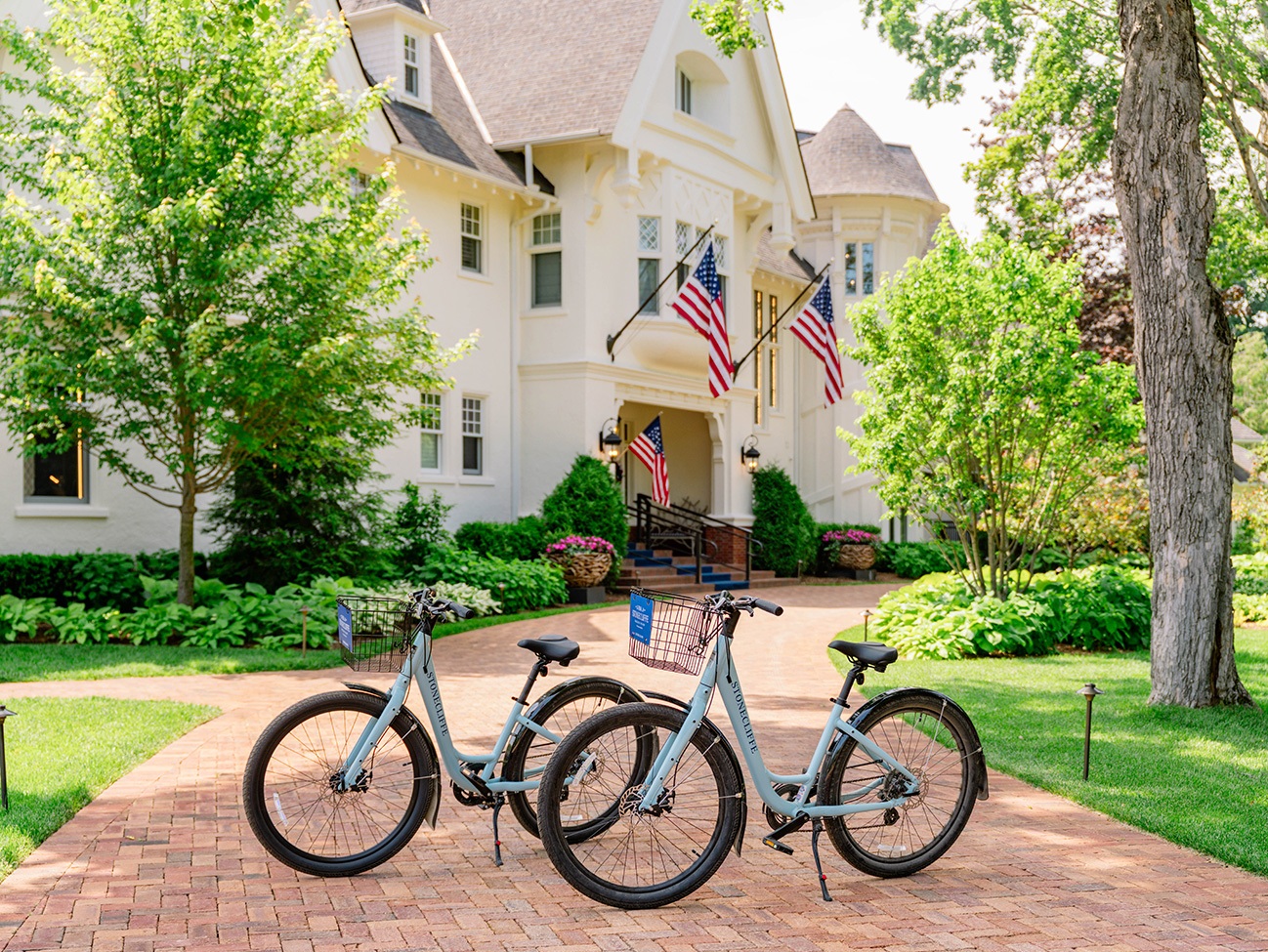 two bikes parked in front of a house