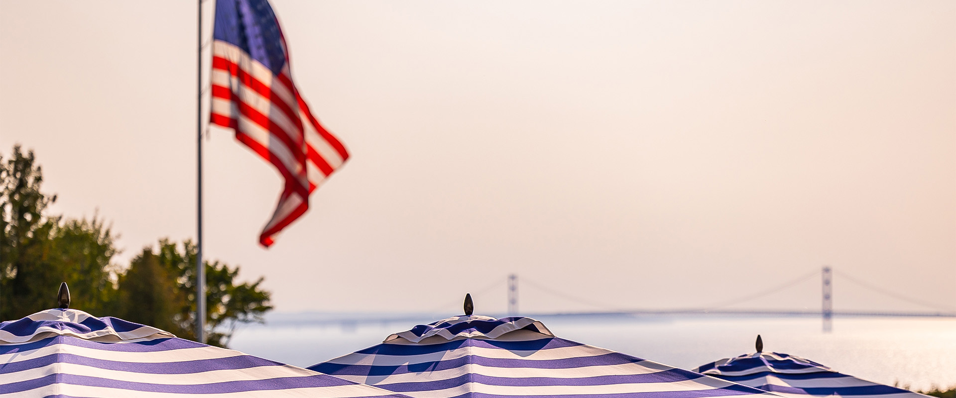 a flag and umbrella on a beach
