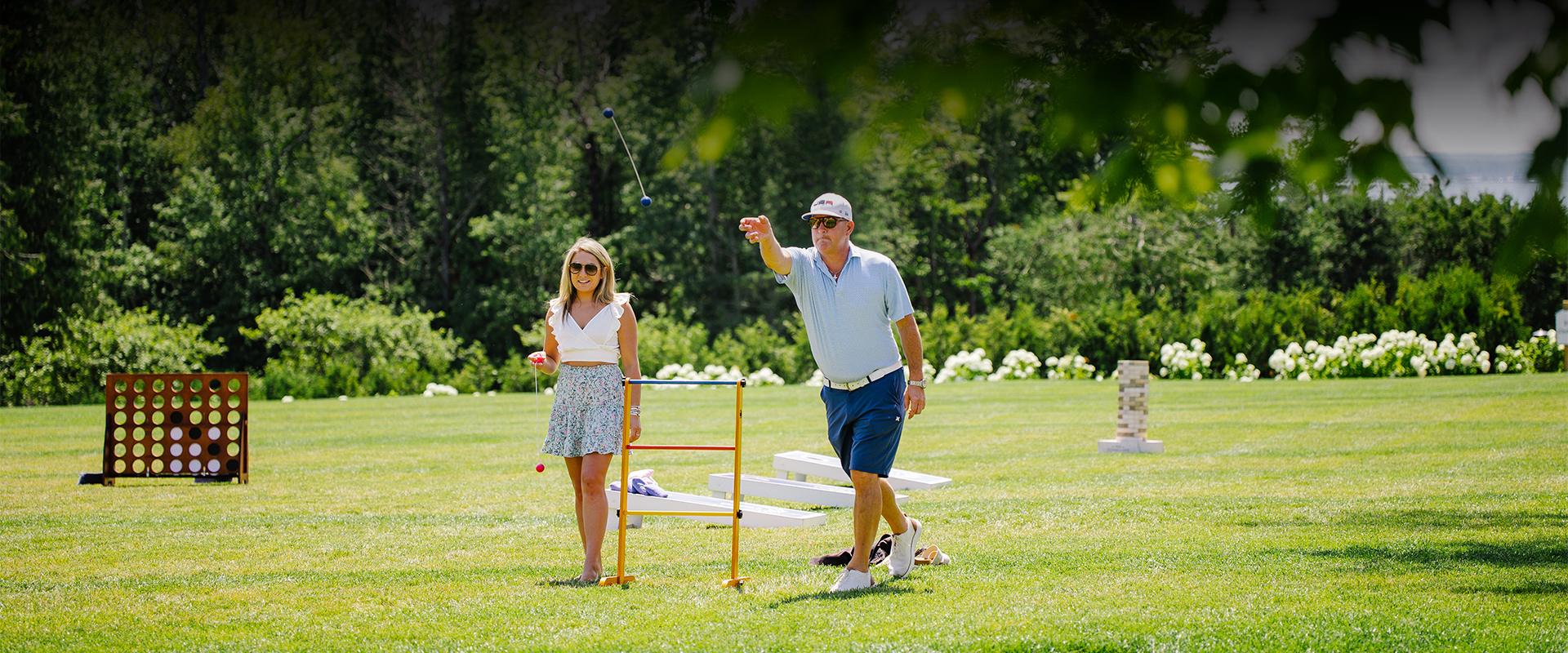 Guests enjoying outdoor events and activities at The Inn at Stonecliffe on Mackinac Island, including lawn experiences with scenic Straits views