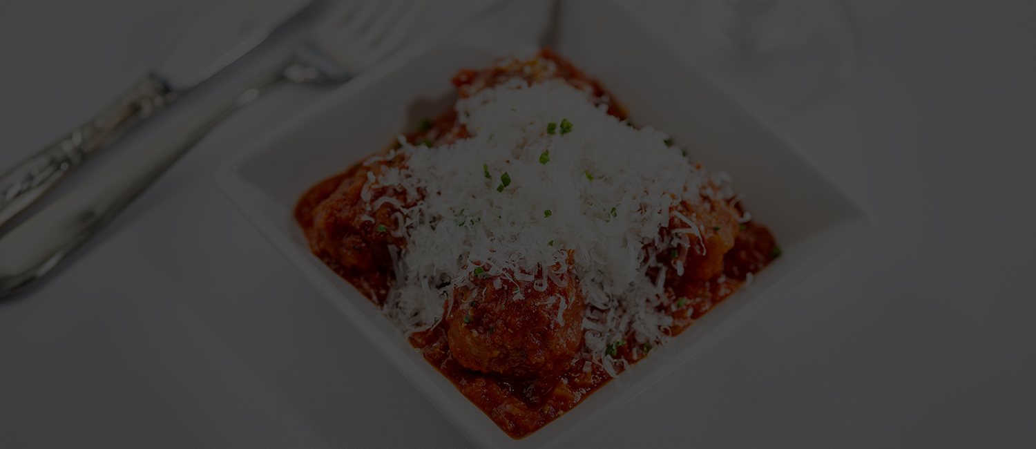 a bowl of food with grated cheese