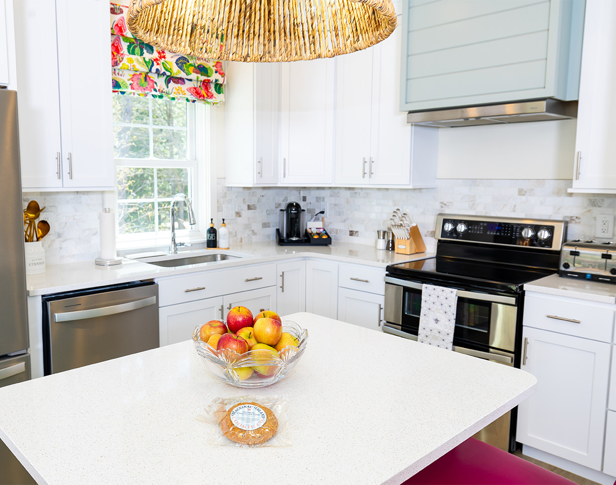 Modern cottage kitchen with island and stainless appliances at The Inn at Stonecliffe, one of the upscale Mackinac Island hotels.